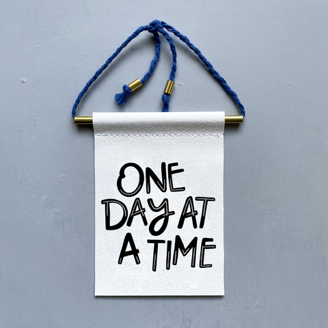 One Day At A Time Brass and String Hanging Banner