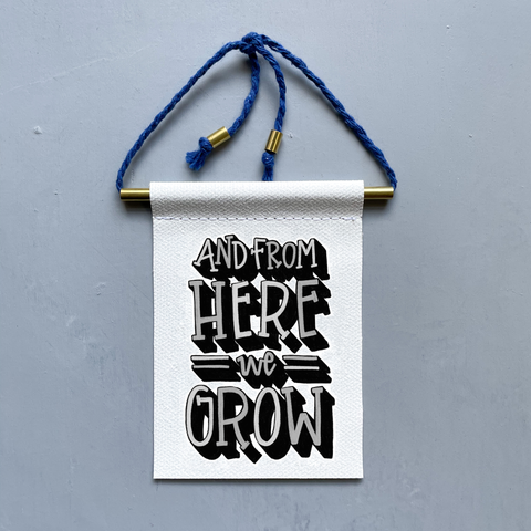 And From Here We Grow Brass and String Hanging Banner