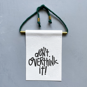 Don't Overthink It Brass and String Hanging Banner