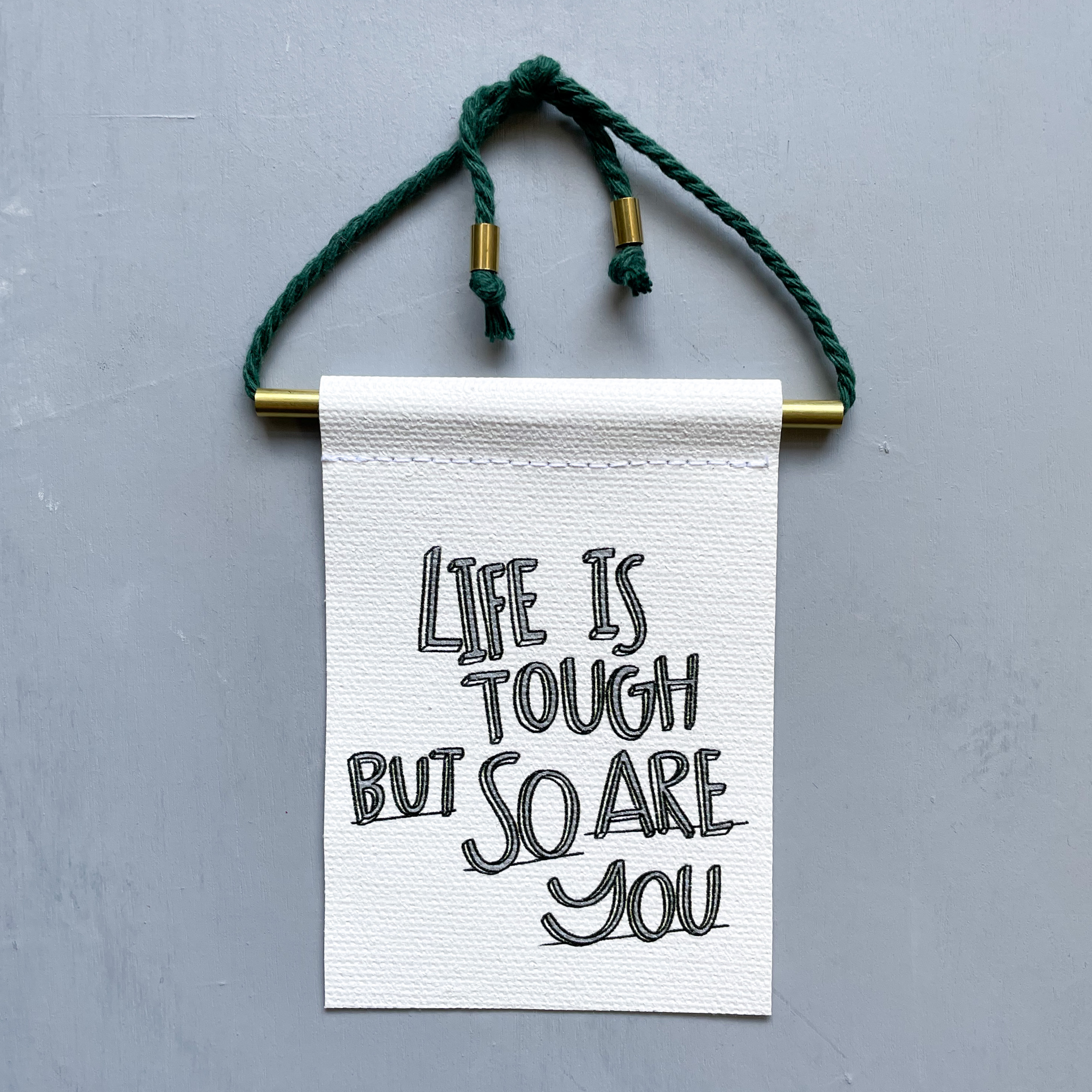 Life Is Tough But So Are You Brass and String Hanging Banner