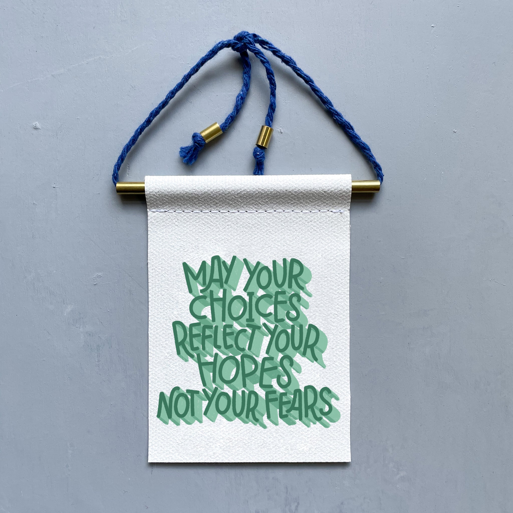 May Your Choices Reflect Your Hopes Not Your Fears Brass and String Hanging Banner