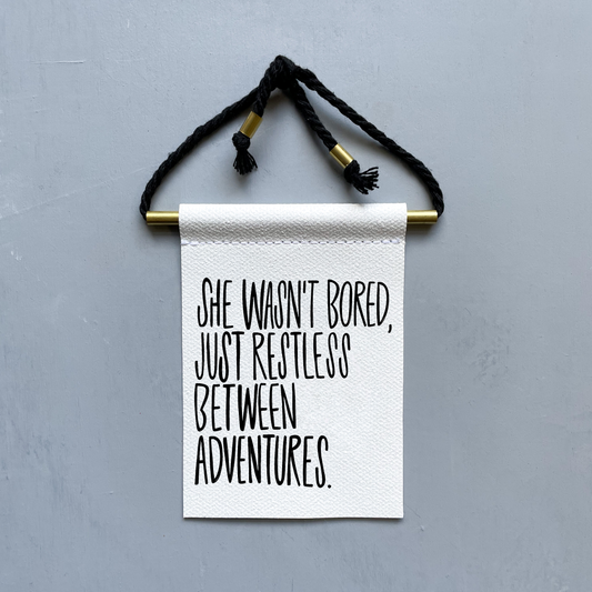 She Wasn't Bored, Just Restless Between Adventures Brass and String Hanging Banner