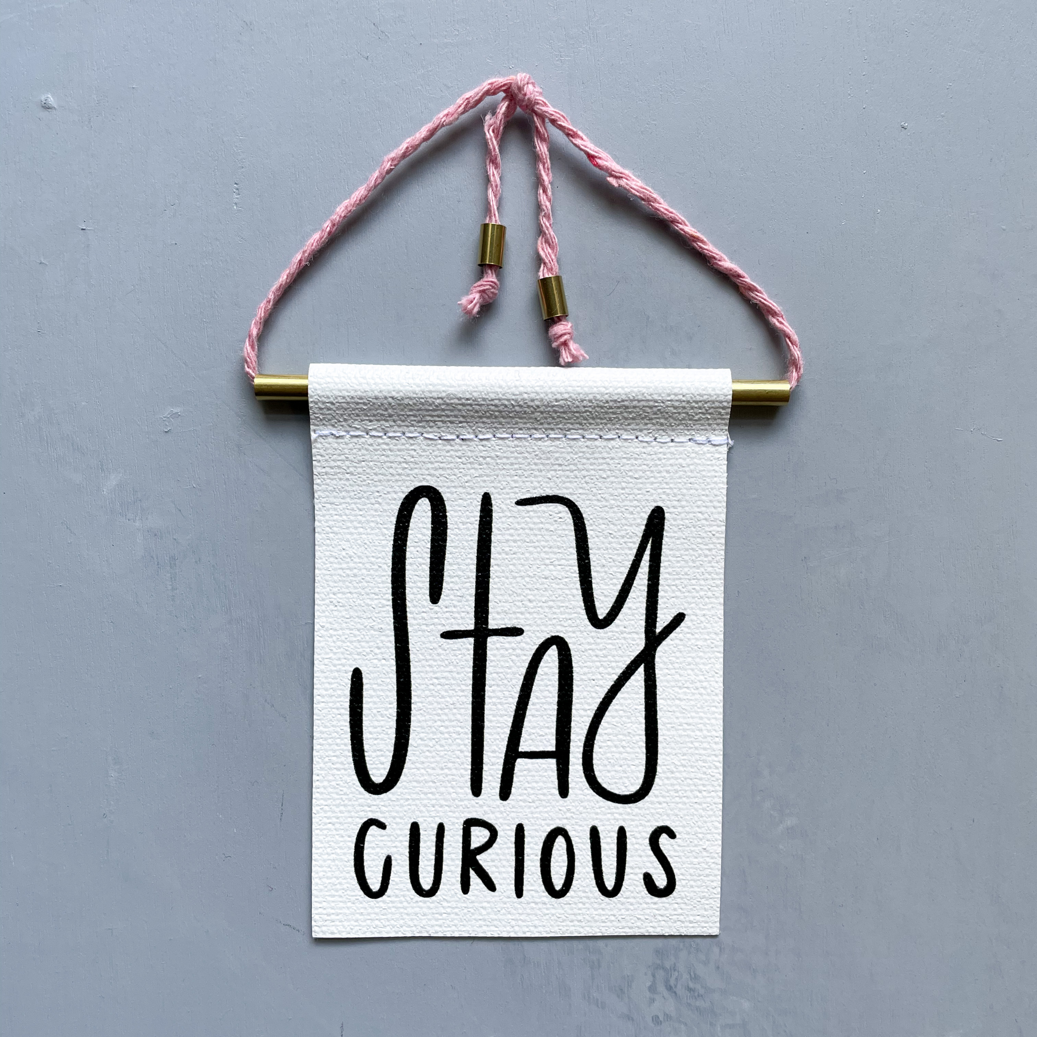Stay Curious Brass and String Hanging Banner