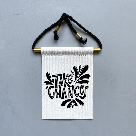 Take Chances Brass and String Hanging Banner