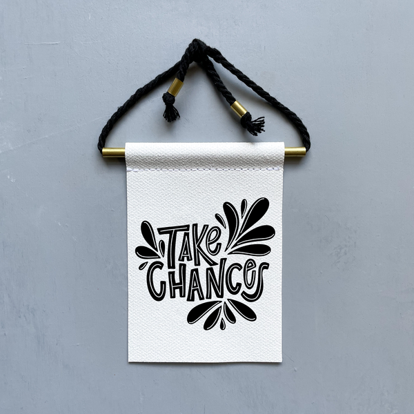 Take Chances Brass and String Hanging Banner